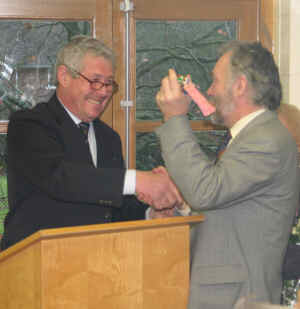 George Beckett hands the keys to Gordon de la Mare